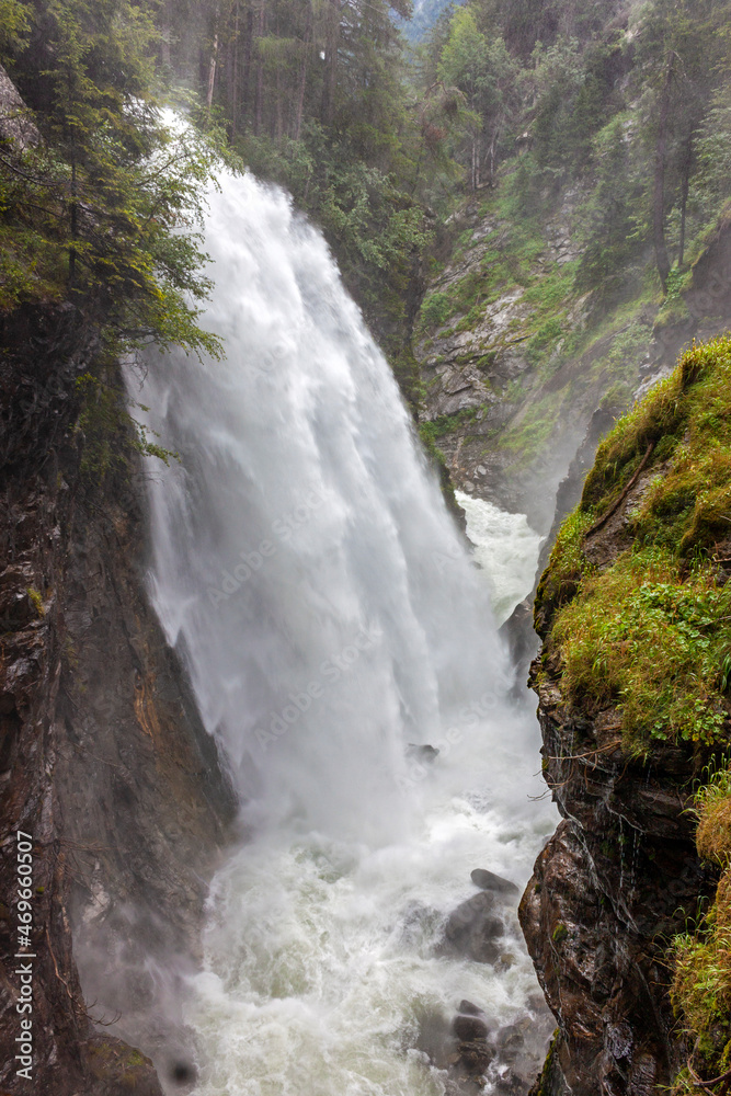 Obraz premium The largest of the three riva di tures waterfalls.The three Riva waterfalls are located in Valle Aurina, at the entrance to the Vedrette di Ries-Aurina Natural Park.
