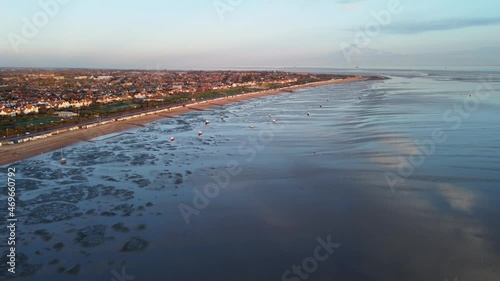 Wallpaper Mural Panoramic view over the sea at southend beach showing boats in the water during low tide, patterns in the water and town in the background. Drone aerial view shot Torontodigital.ca