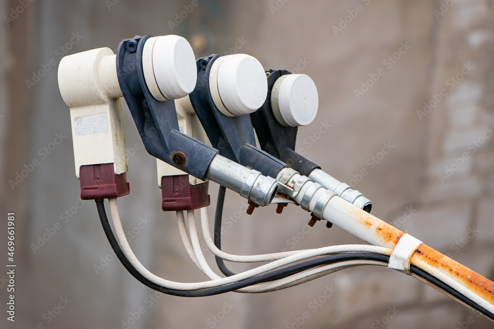 Multi-feed satellite antenna with multiple feeds converters closeup, modern telecommunication diversity Multi-feed satellite antenna with multiple feeds converters closeup, modern telecommunication diversity