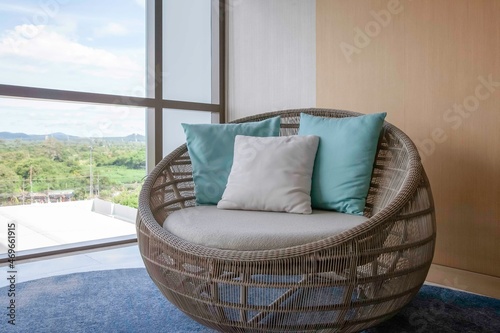 Empty brown plastic rattan sofa on the living room of the house