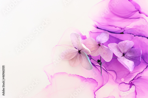Fototapeta Naklejka Na Ścianę i Meble -  Creative image of pastel violet and pink Hydrangea flowers on artistic ink background. Top view with copy space