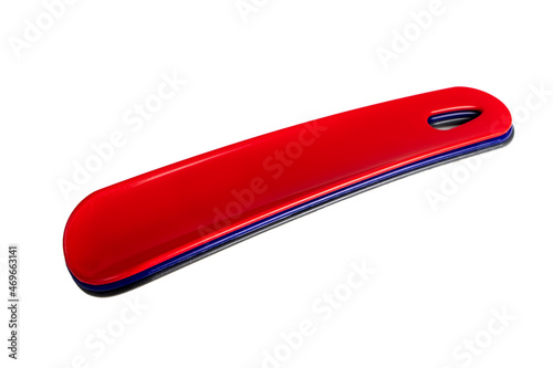 Set of colorful Shoehorns isolated on white background. There is black, blue and red long spoon.