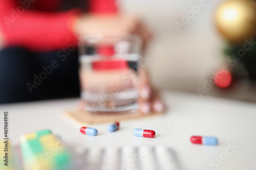 Jelly capsules scattered on table daily dose of medication for person