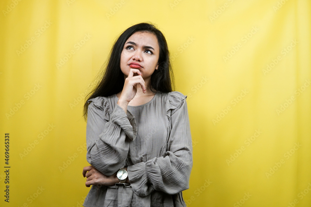 Beautiful young woman thinking, stressed, depressed, many problems, looking for ideas and solutions, isolated Beautiful young woman thinking, stressed, depressed, many problems, looking for ideas and solutions, isolated