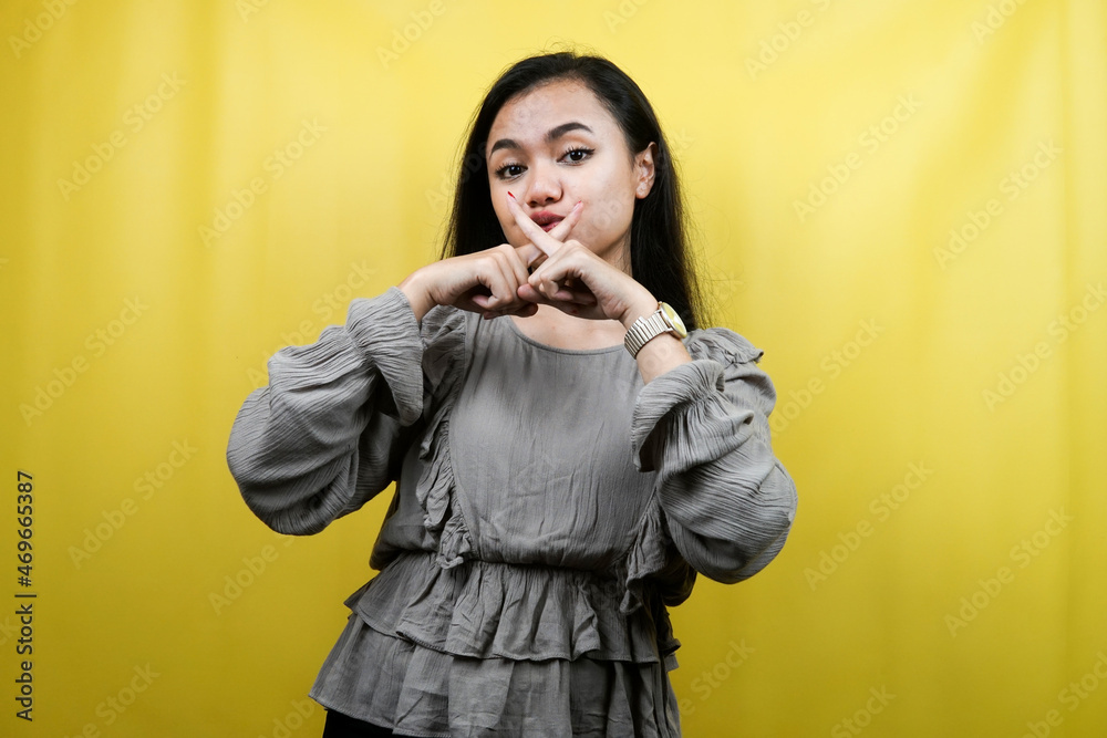 Beautiful young woman with hands shh, shhh, hands on mouth, don't make noise, please be quiet, isolated Beautiful young woman with hands shh, shhh, hands on mouth, don't make noise, please be quiet, isolated