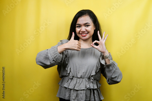 Beautiful young woman, thumbs up hand, ok sign, good job, victory, isolated