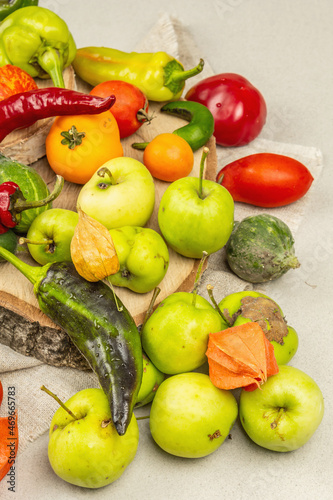 Trendy ugly organic vegetables and fruits on stone concrete background