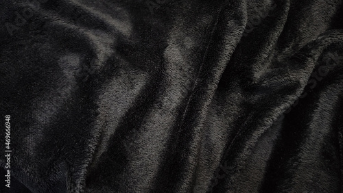 Black fur texture of artificial fur backing in clothes