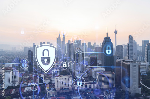 Photography Padlock hologram on sunset panoramic cityscape of Kuala Lumpur, Malaysia, Asia
