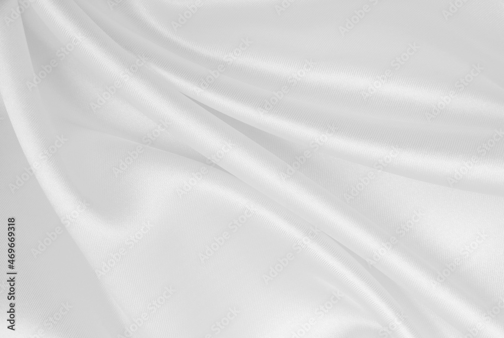Smooth elegant white silk or satin luxury cloth texture as wedding background. Luxurious background design Smooth elegant white silk or satin luxury cloth texture as wedding background. Luxurious background design