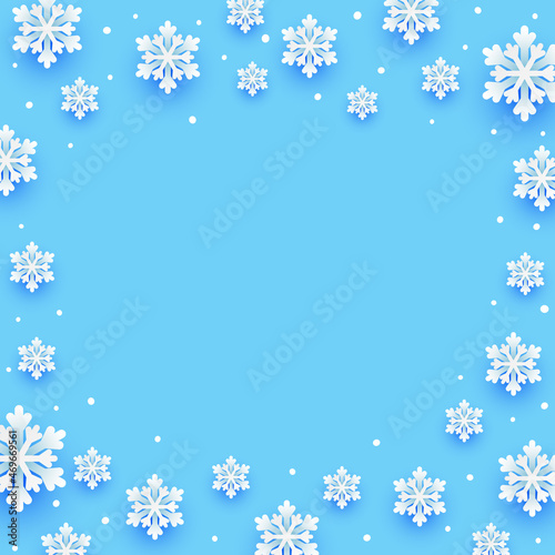 Paper snowflakes Christmas frame on blue background for winter holidays design