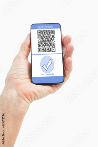 Wallpaper Mural Man holding smartphone with covid 19 vaccine passport Torontodigital.ca