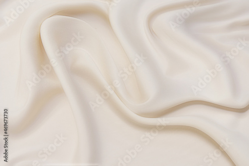 Abstract background texture of natural light color fabric. Fabric texture of natural cotton or linen, silk or satin, wool or jersey textile material. Luxurious white canvas background.