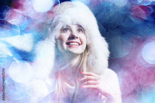 model in winter hat / beautiful adult girl in a big fur hat, winter clothes, Christmas holiday