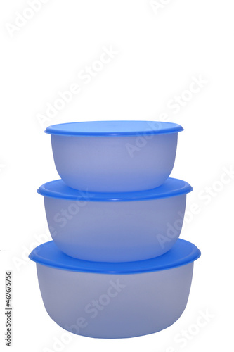 Food storage container. translucent plastic food storage and cooking containers with blue lids for home use. on isolated white background 