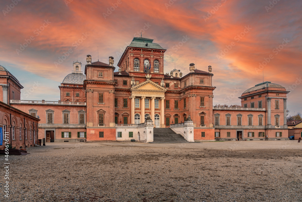 The Royal Castle of Racconigi (14th-18th century), Piedmont, Italy Summer royal residence of the Savoy family. UNESCO heritage. Sunset sky