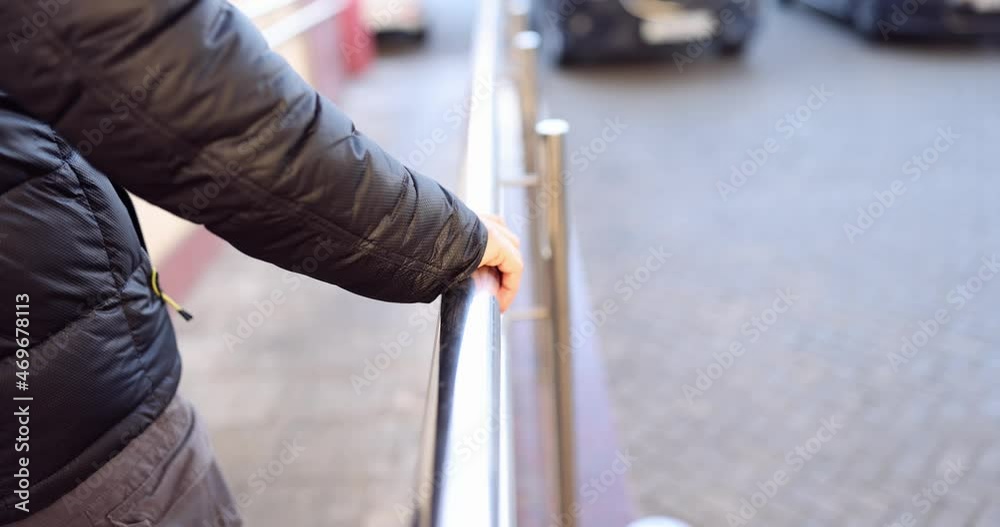 Man comes down holding on to metal railing slow motion 4k movie Man comes down holding on to metal railing slow motion 4k movie
