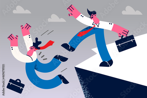 Angry businessman punch colleague off cliff 