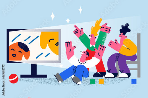 Happy children watch TV at home together 