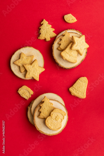 Different festive shape Scottish shortbread cookies on the red backgrounbd. Christmas sweet cohcept.