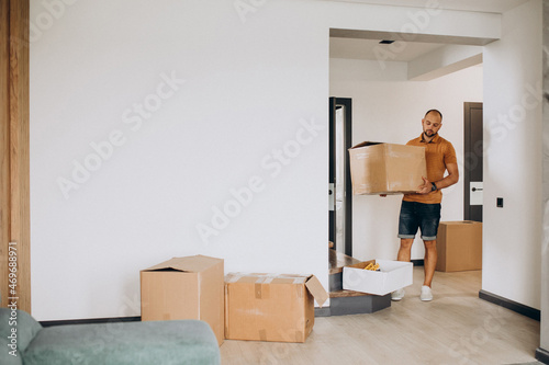 Young man moving into new house
