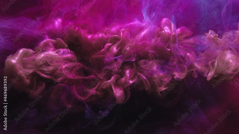 Flare fluid. Smoke trail motion. Logo reveal effect. Ink in water splash. Magenta pink purple blue color glitter dust cloud animation for transition on dark abstract art background. Flare fluid. Smoke trail motion. Logo reveal effect. Ink in water splash. Magenta pink purple blue color glitter dust cloud animation for transition on dark abstract art background.