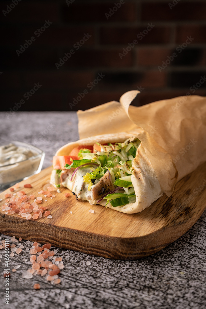 doner kebab, a shawarma in a pit of fresh vegetables and meat. with