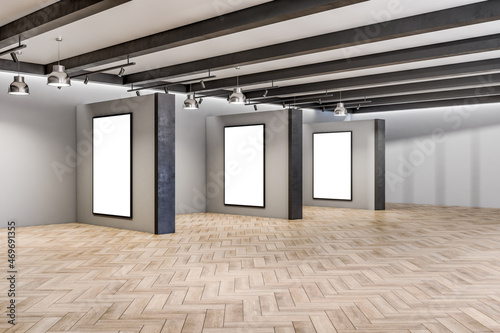 Modern concrete and wooden empty interior with columns and white mock up banners on wall. Gallery and exhibition concept. 3D Rendering.