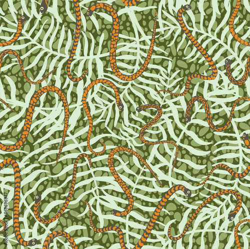 Cute and trendy vector seamless pattern with hand drawn snakes and palm leaves and tropical plants. Botanical and animalistic ornament for printing on fabrics and paper