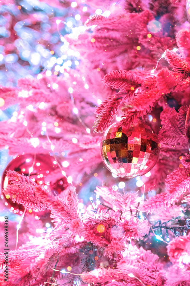 Christmas mirror evening bauble disco ball with pink fir tree and garland.