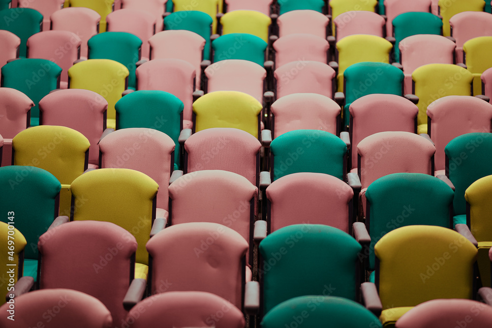 Fototapeta premium Assortment of colorful seats seen in auditorium