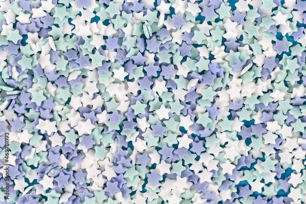 Star shaped sugar sprinkles with blue, teal and white color