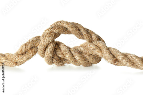 Hemp rope with knot on white background, closeup