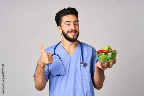 birth bearded male doctor plate with vegetables healthy food treatment calories