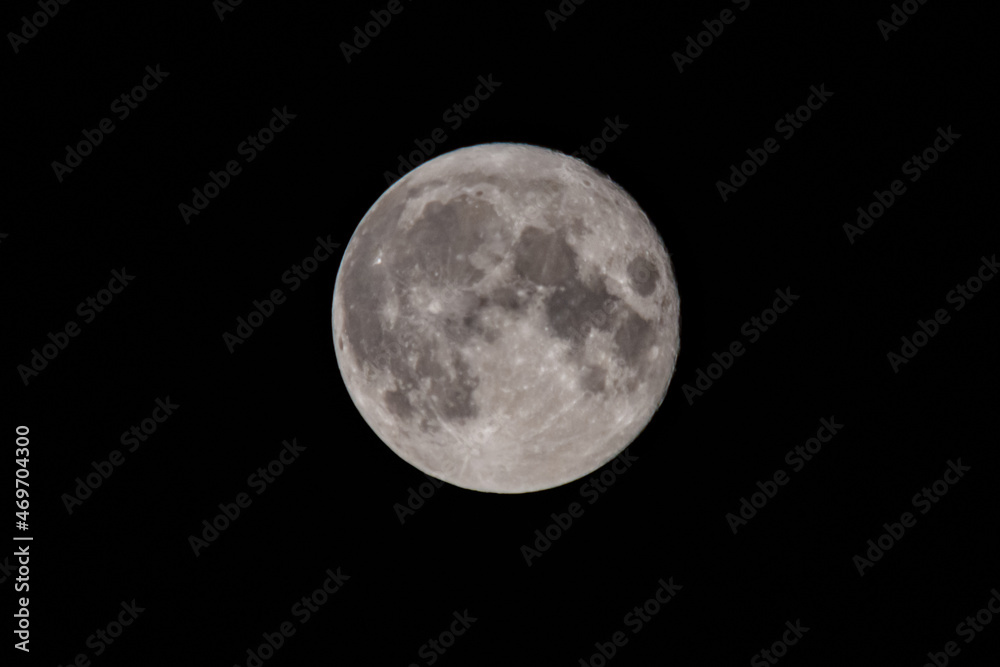 Full moon in a black sky. Astronomy concept Full moon in a black sky. Astronomy concept