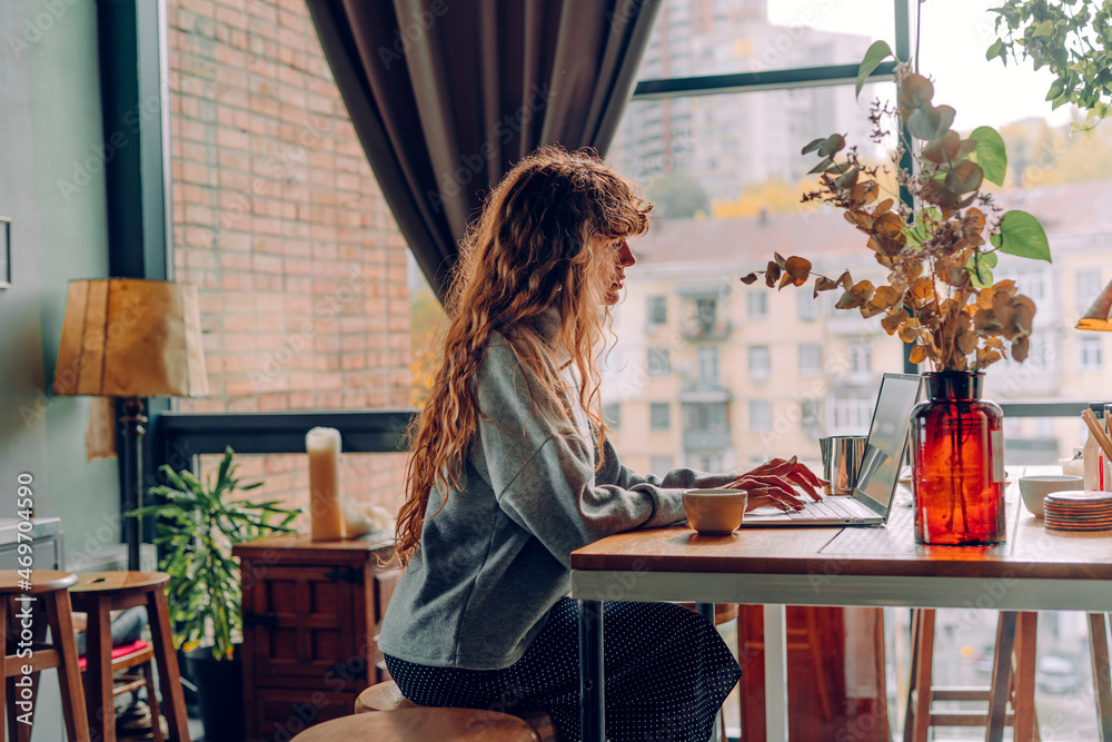 Business woman with curly hair working at the remote office Business woman with curly hair working at the remote office