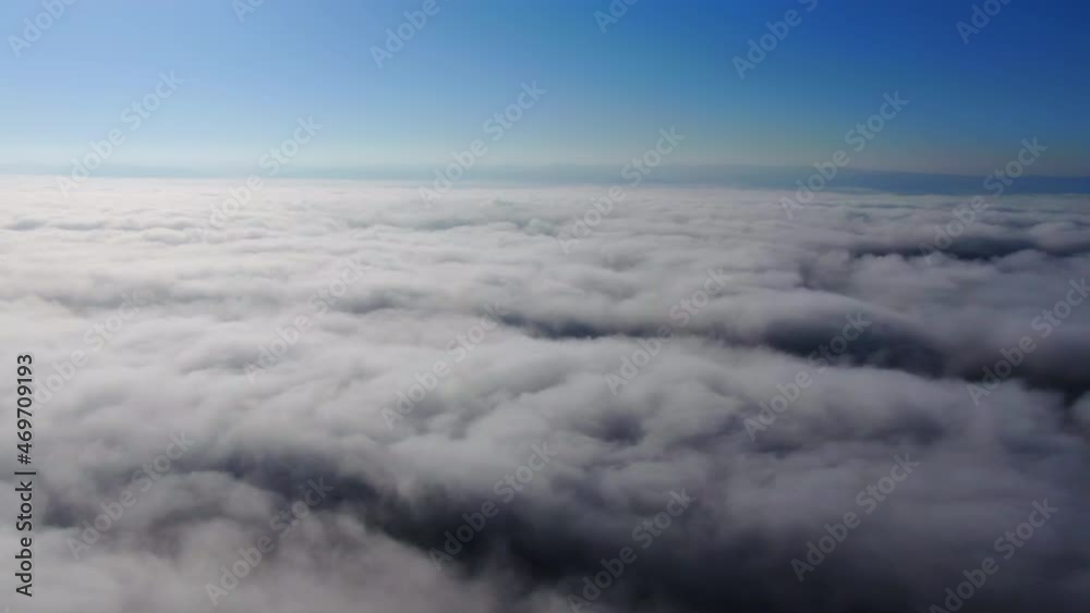Flying through beautiful thick fluffy clouds. Amazing timelapse of soft white clouds moving slowly on the clear blue sky in pure daylight. Direct view from the cockpit Flying through beautiful thick fluffy clouds. Amazing timelapse of soft white clouds moving slowly on the clear blue sky in pure daylight. Direct view from the cockpit