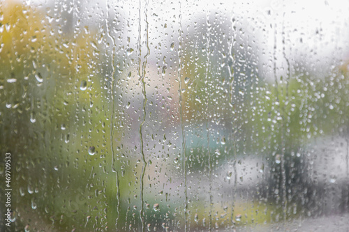 Window glass with water drops, closeup. Rainy weather