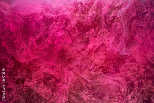 Pink smoke on black ink background, colorful fog, abstract swirling touch ocean sea, acrylic paint pigment underwater