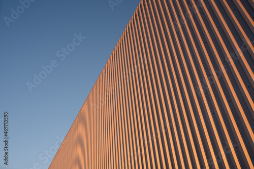Tinplate and metal architectural wall of the building against the sky