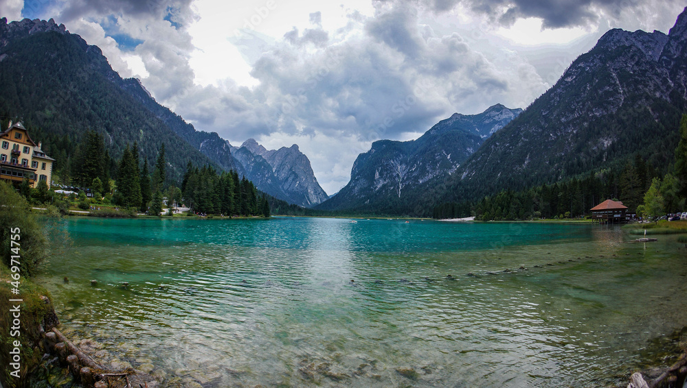 Dolomites, Italy, August 2017, alpine lake Braies with turquoise water in the background of mountains