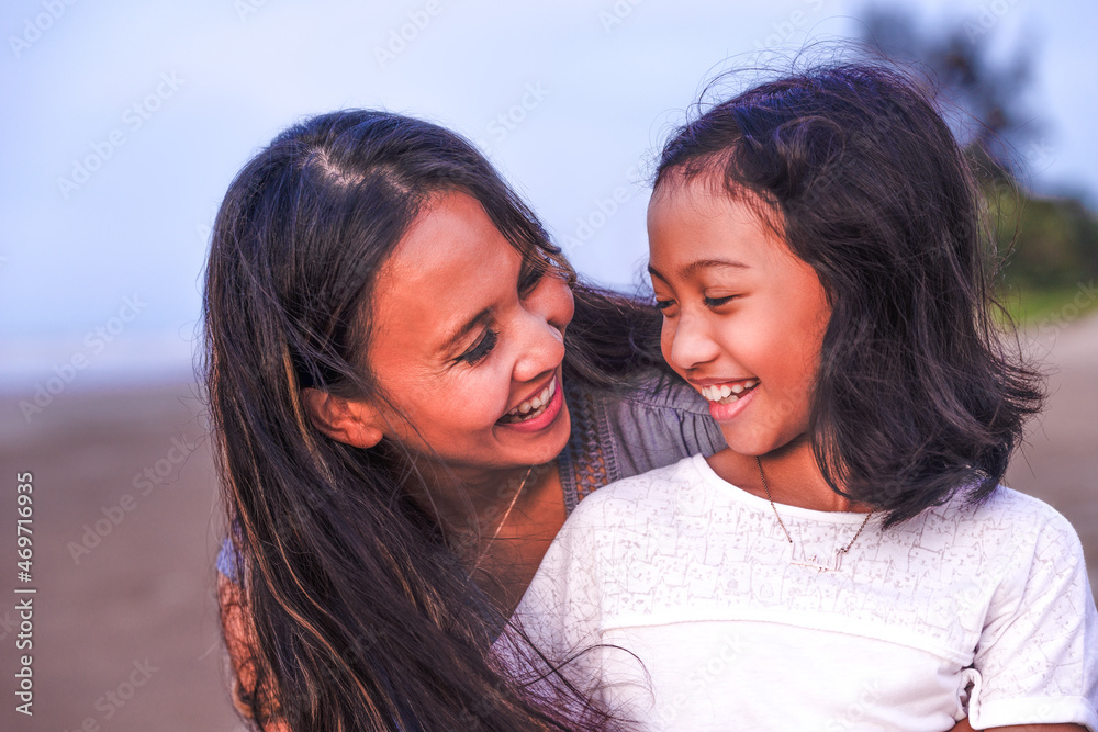 family, leisure and people concept-portrait of mother communicating with teenager daughter with love outdoor family, leisure and people concept-portrait of mother communicating with teenager daughter with love outdoor