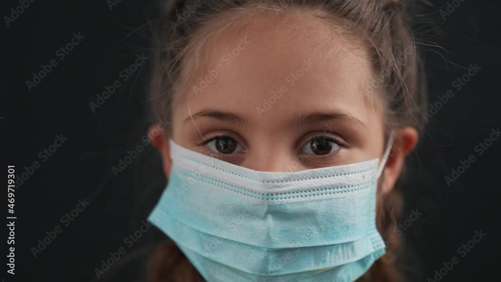 Girl in protective mask. Child face in safety mask. Prevention of diseases by virus. Portrait of girl in protective mask. Schoolgirl in medical mask. Close-up of child face. Fighting virus at school Girl in protective mask. Child face in safety mask. Prevention of diseases by virus. Portrait of girl in protective mask. Schoolgirl in medical mask. Close-up of child face. Fighting virus at school