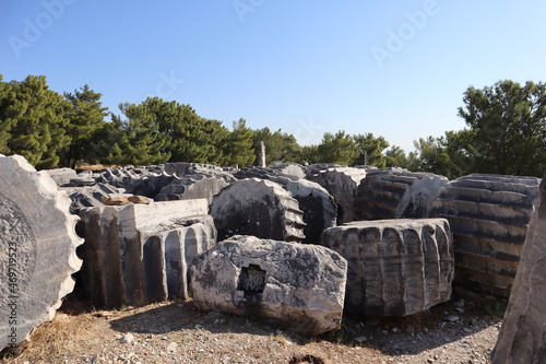 Scenic view with marble column fragments in archaeological site Priene in Turkey photo