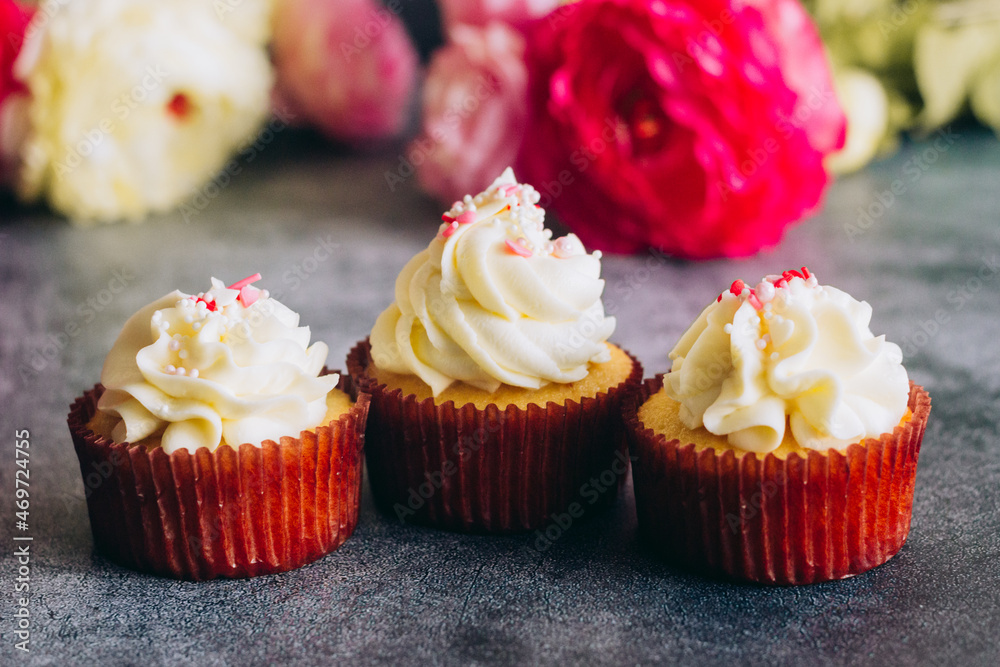 Delicious cupcakes. Cupcakes on a concrete table