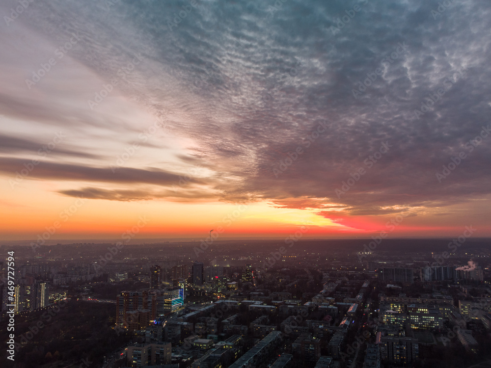 Aerial scenic vivid colorful sunset panoramic view with epic skyscape. Kharkiv city center, Pavlove pole residential district streets and buildings in evening light