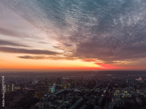 Aerial scenic vivid colorful sunset panoramic view with epic skyscape. Kharkiv city center  Pavlove pole residential district streets and buildings in evening light
