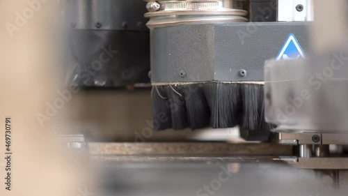Production process in a furniture factory, woodworking machine mechanism close up. Workflow in a furniture factory. Woodworking factory