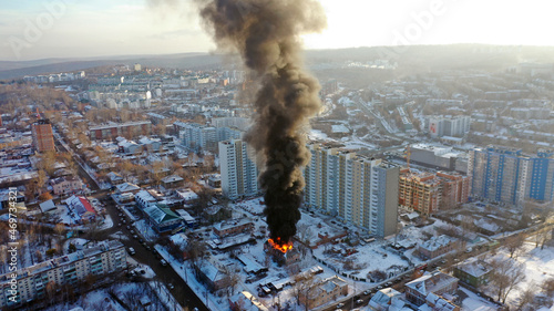 Fire in the house. An apartment building in Irkutsk is on fire. A flame of fire engulfed the building.