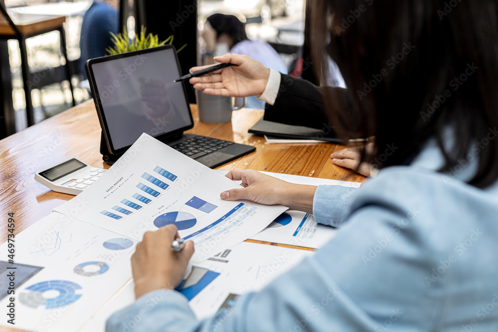 Fototapeta premium Meeting room atmosphere, business people meeting together on finance topics, they are working together to plan and solve corporate finance issues. Concept of business administration and finance.